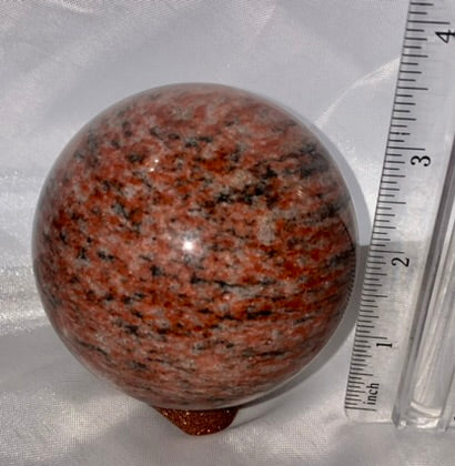 Red Sesame Jasper Sphere 1m - polished red, cream, black, and gray patterned sculpture