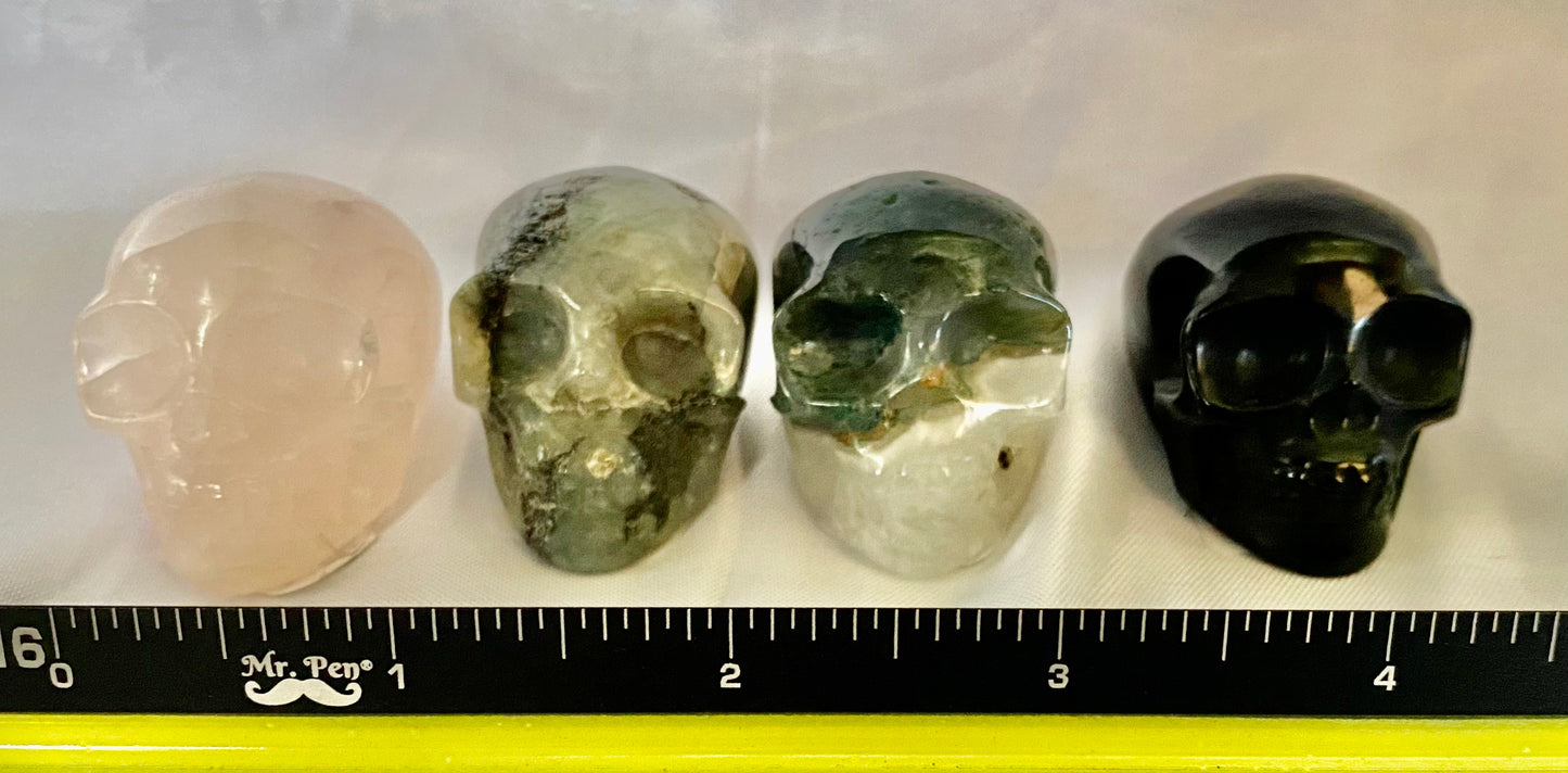 Gemstone Skull Figurines - Halloween decor, spooky multicolored polished sculpture