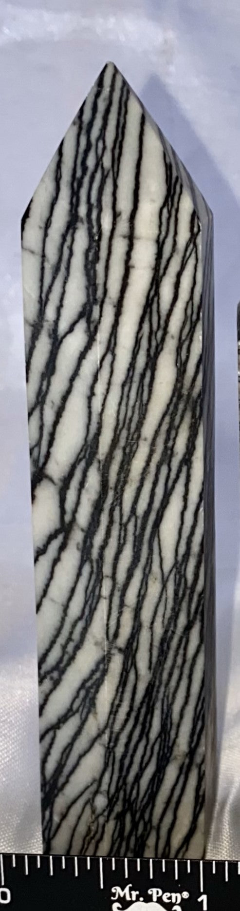 Spiderweb Jasper Point l1  - striped black cream white polished stone sculpture