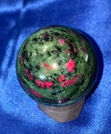 Ruby in Zoisite Sphere (UV Reactive) - polished green red black stone sculpture glows red in blacklight