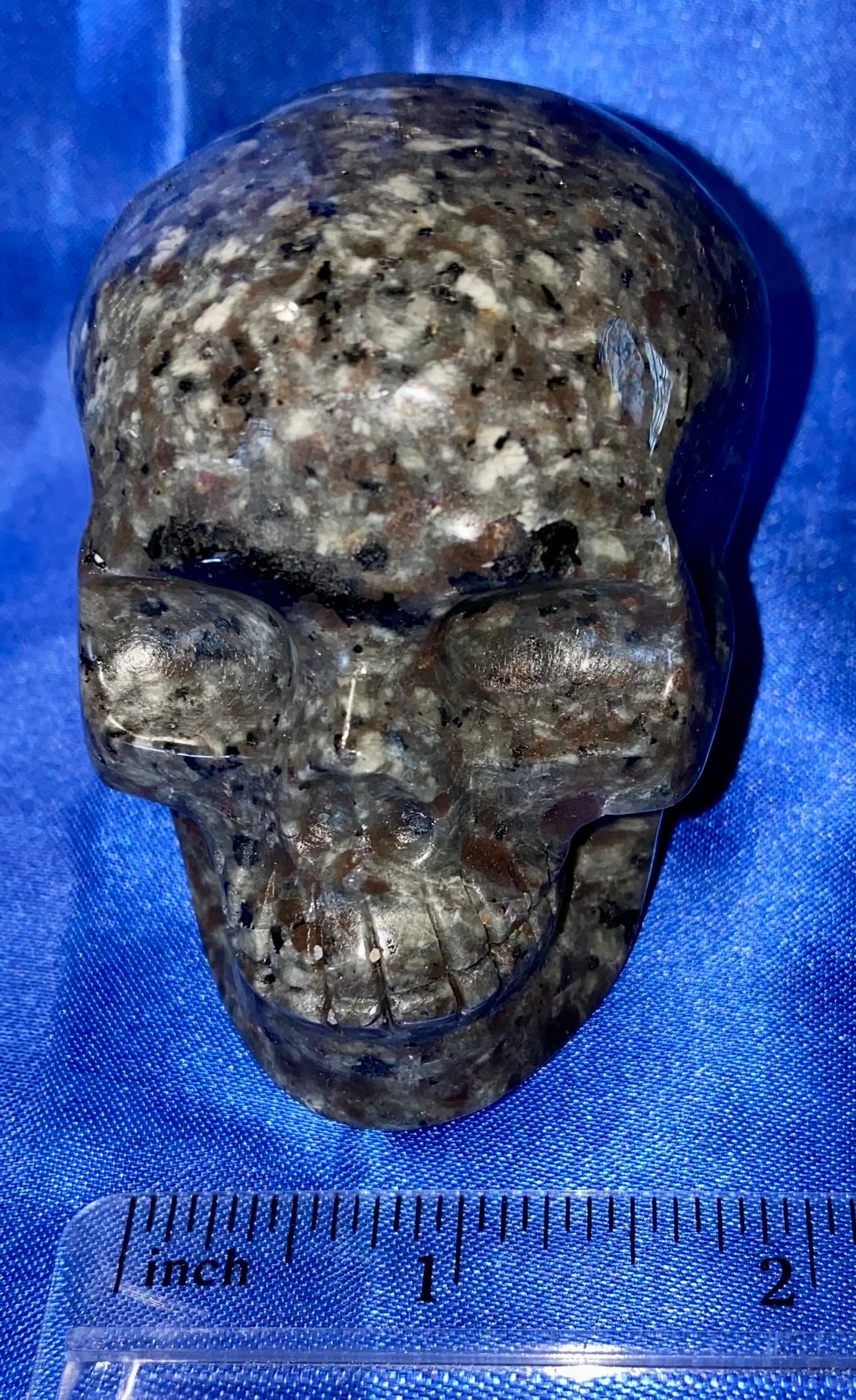 Yooperlite Stone Skull 2 (UV Reactive) - Halloween decor, spooky polished gray black stone sculpture glows red under blacklight