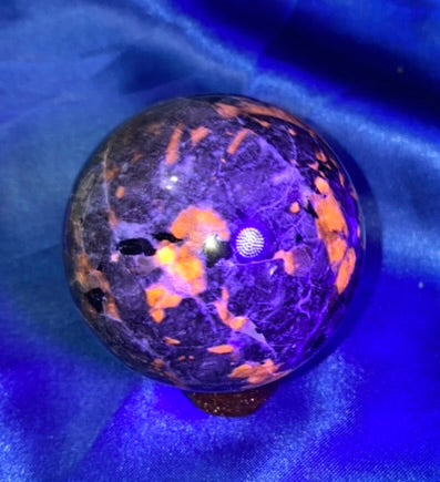 Yooperlite Sphere s8 (UV Reactive) - polished gray black stone sculpture glows red under blacklight